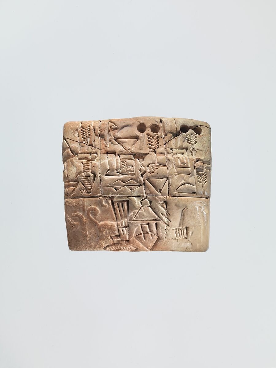 A clay tablet recording grain distribution, probably from Uruk, about 3100-2900 BCE.